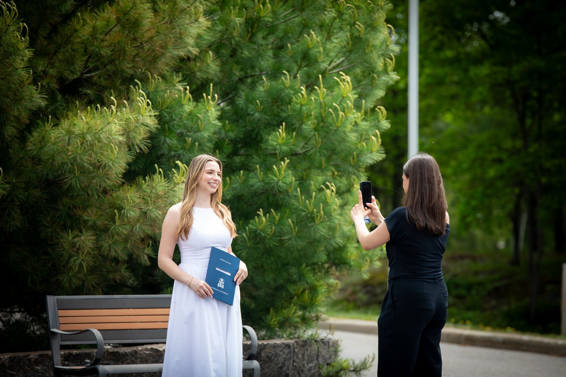 Nipissing University graduate posing for a picture