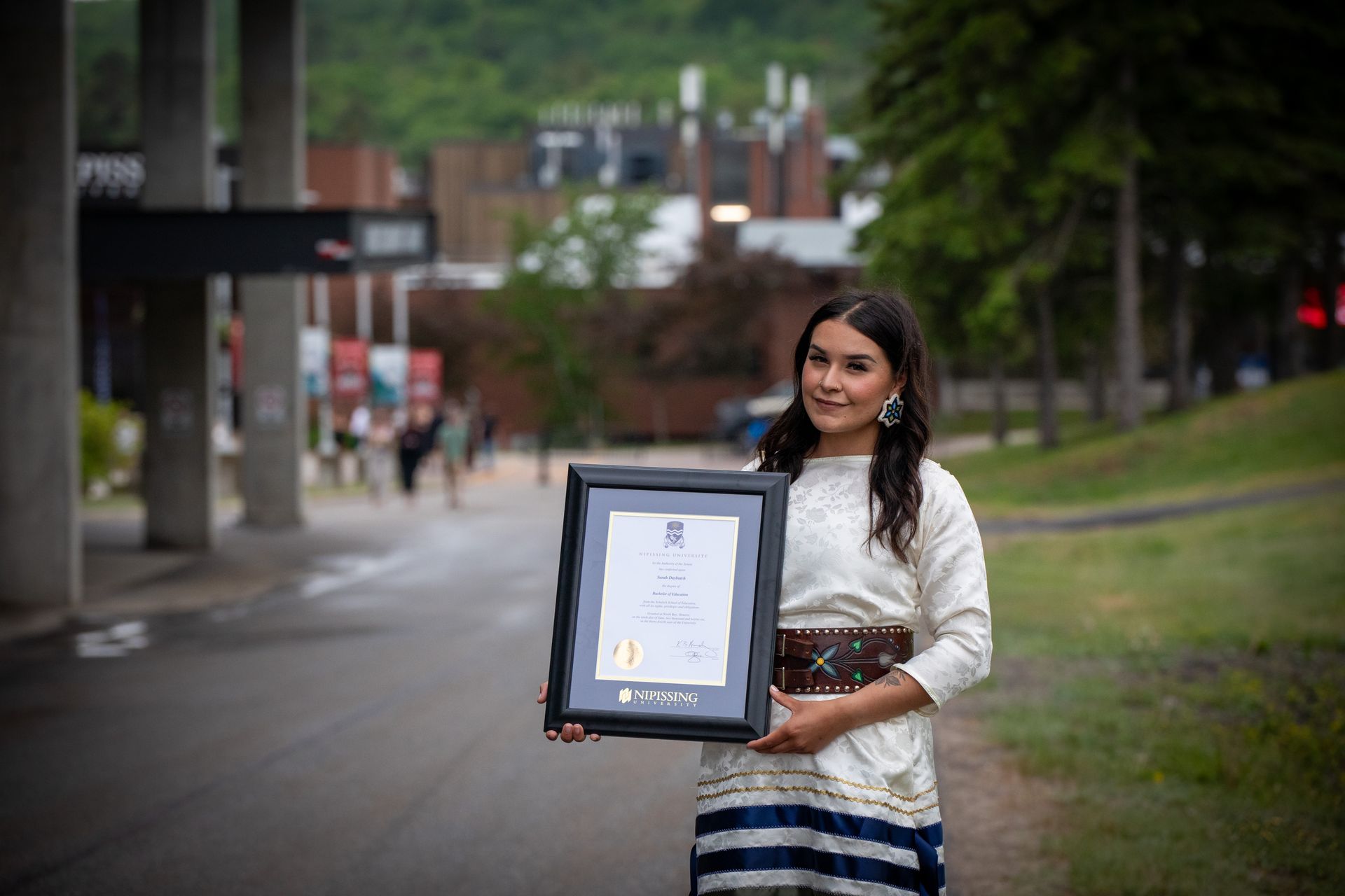Nipissing University graduate posing for a picture