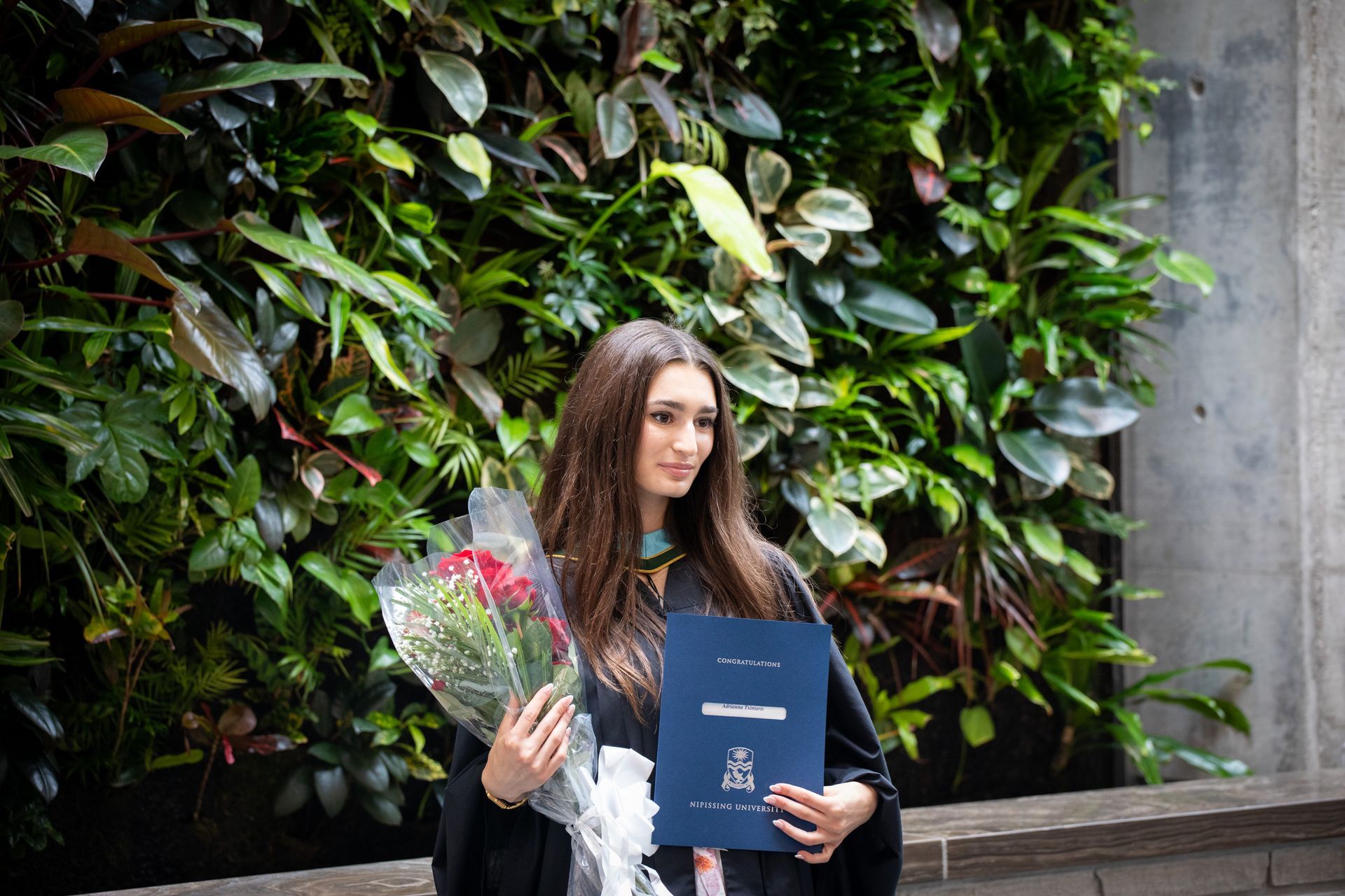Nipissing University graduate posing for a picture