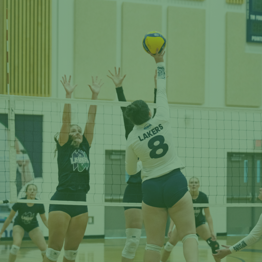 Female Volleyball Player hitting the ball
