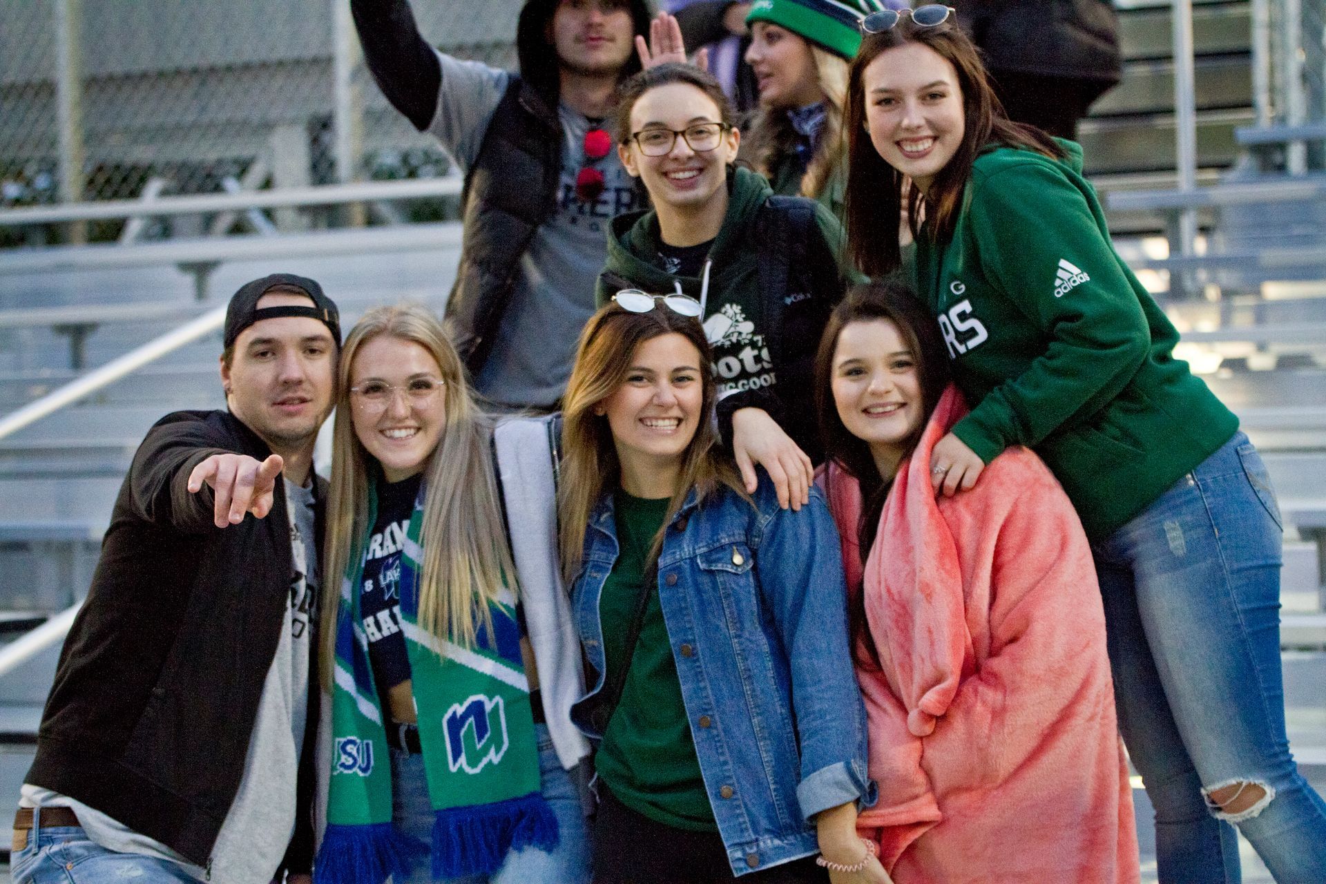 A group of students smiling and posing for the camera