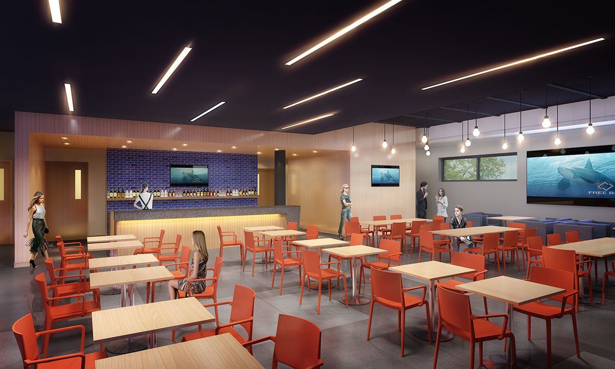 A cafeteria with tables and chairs.