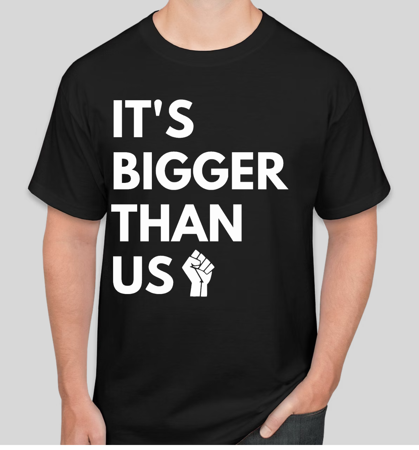 A person wearing black t-shirt with white text: