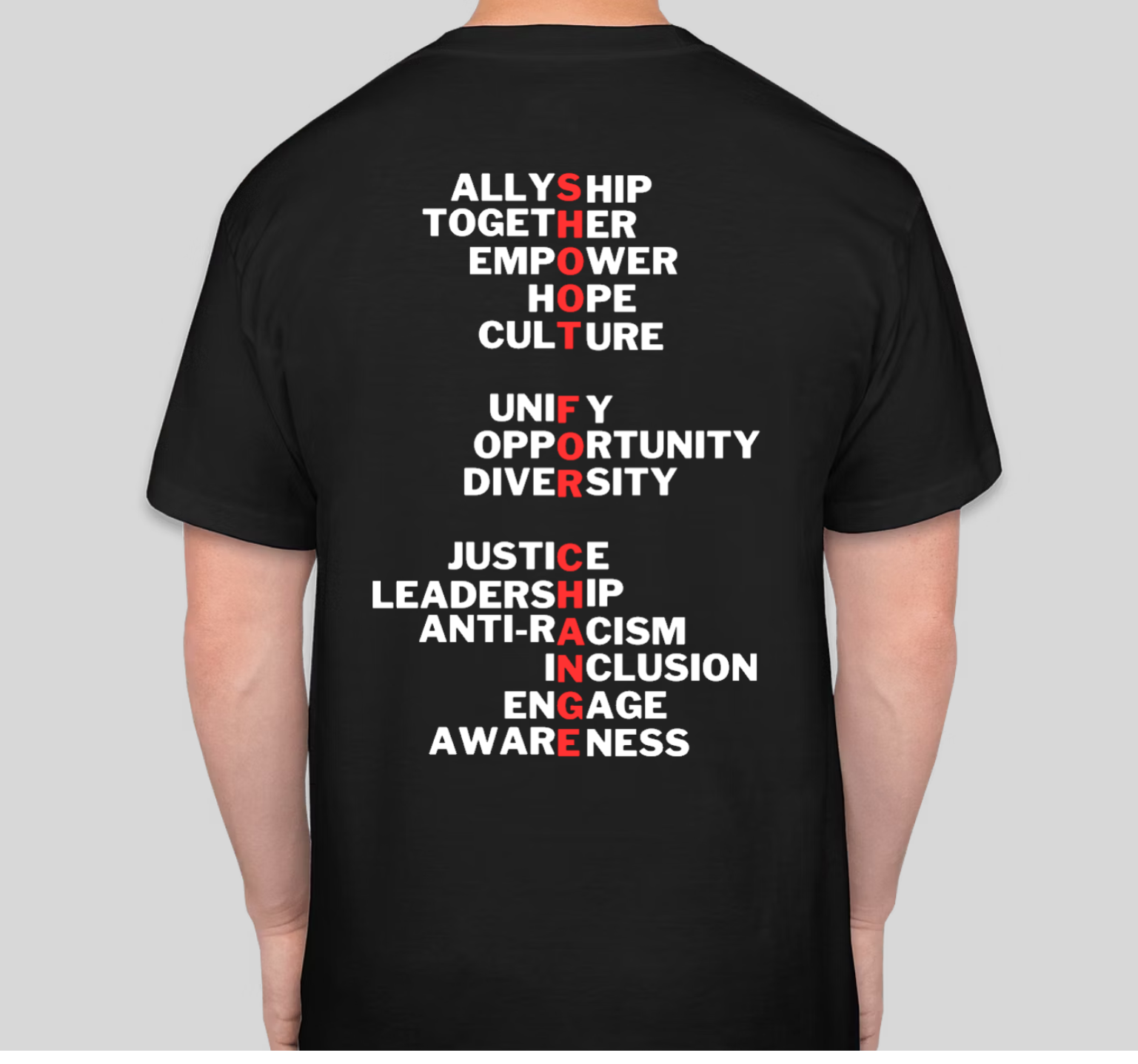 Black t-shirt with white text listing concepts related to social justice;
