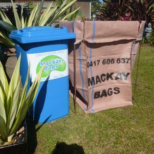 A Blue Bin and Tan Garden Bag Sitting on a Lawn  — Mackay Bags in East Mackay, QLD