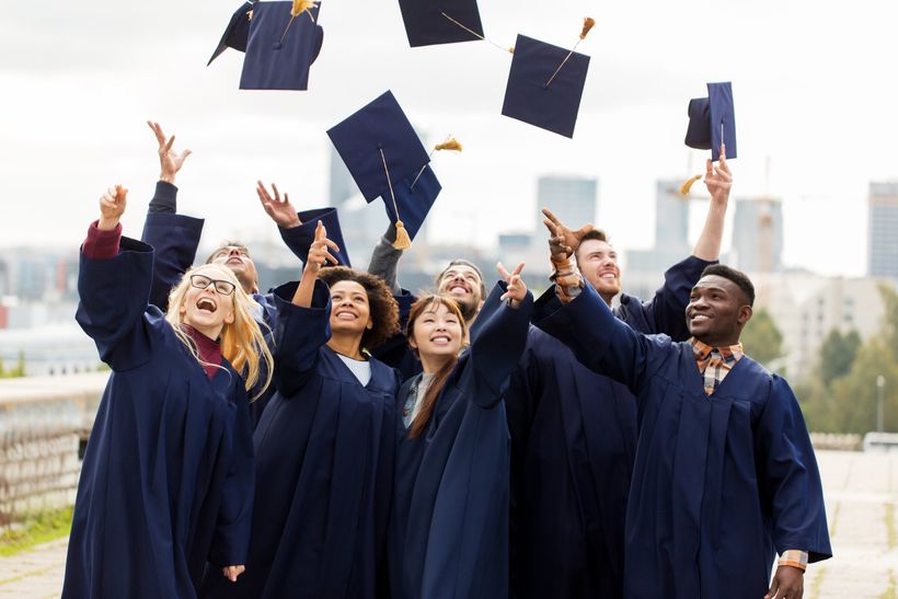 College graduates tossing their caps