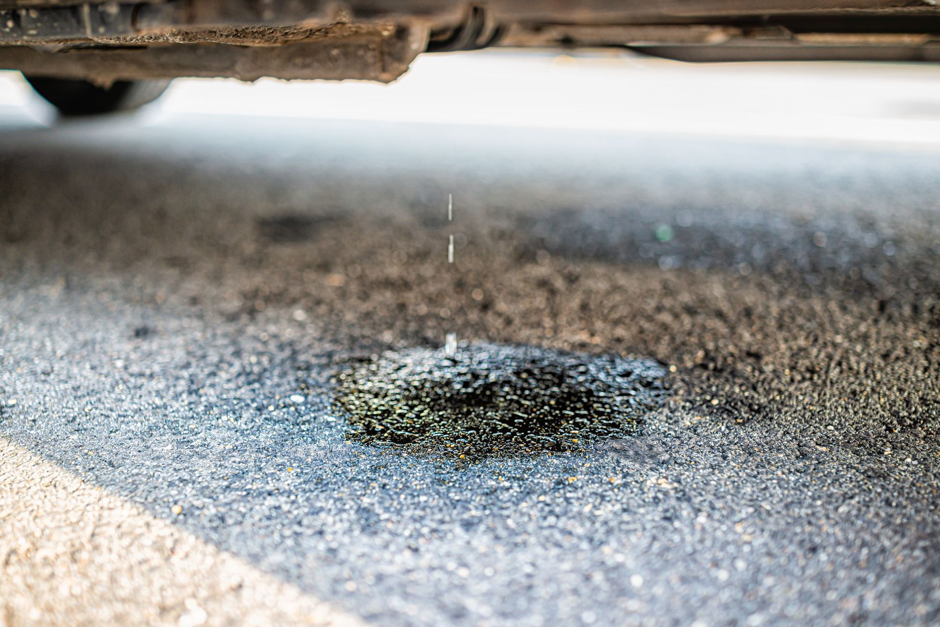 Could That Tiny Fluid Spot Under My Car Mean Something Big? | Pit Shop Auto Repair