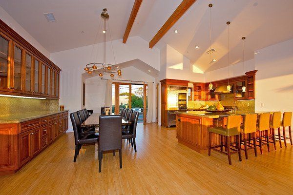 A kitchen with a table and chairs in it