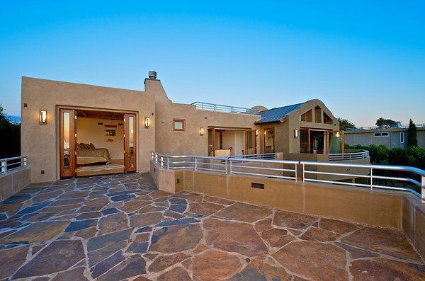A large house with a patio in front of it in Encinitas