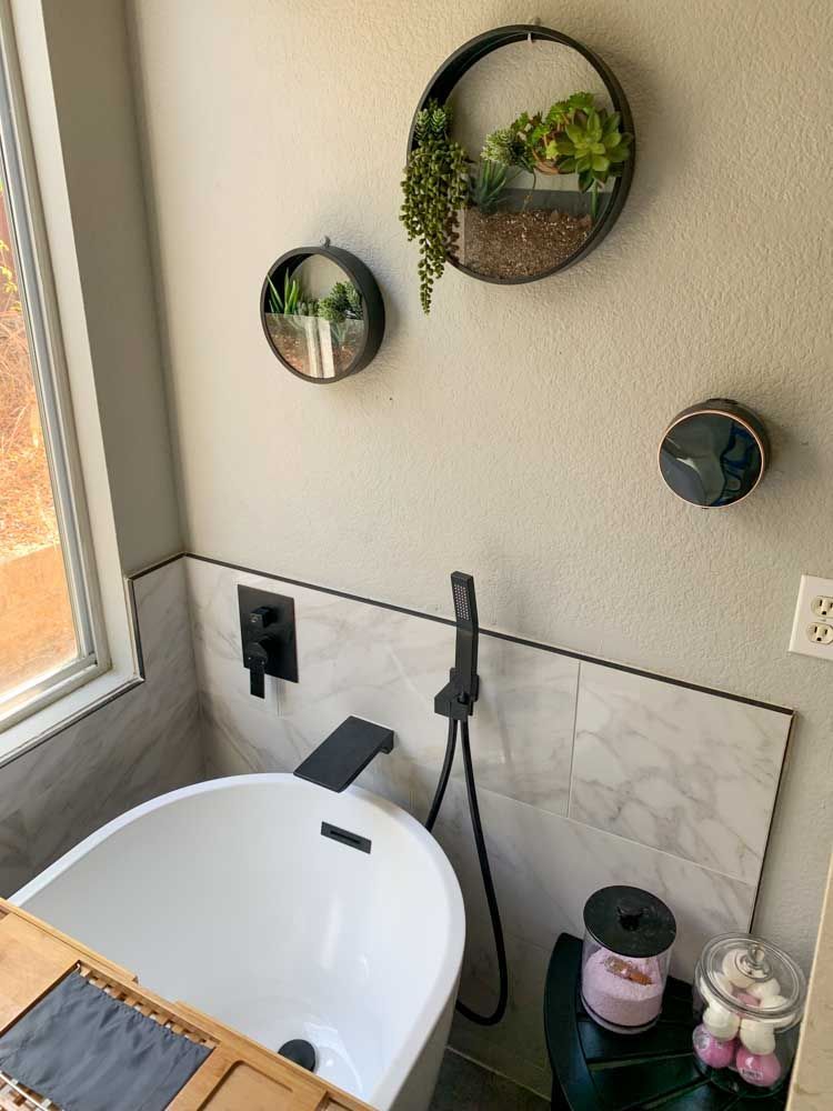 A bathroom in Encinitas with a bathtub and a window.
