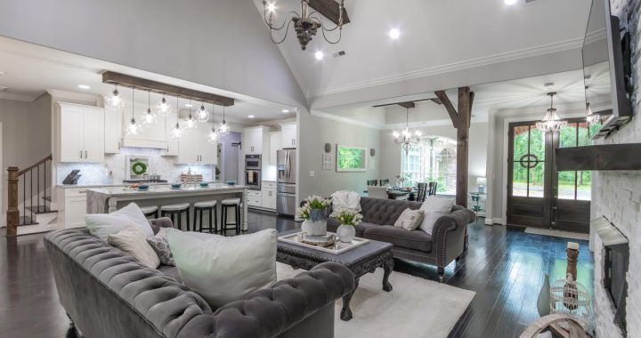 A living room filled with furniture and a fireplace.
