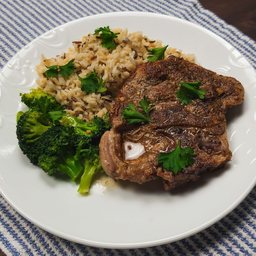 Braised Pork Loin Chop with Steamed Broccoli and Della Basmati Wild Rice Blend