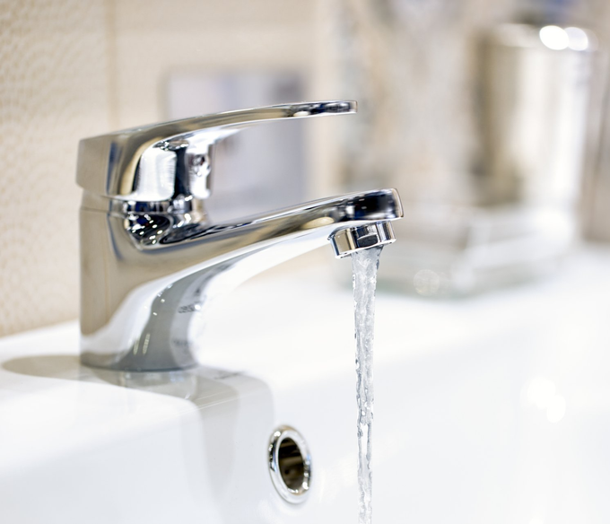Sink Faucet — Faucet Releasing Water in Houston, TX