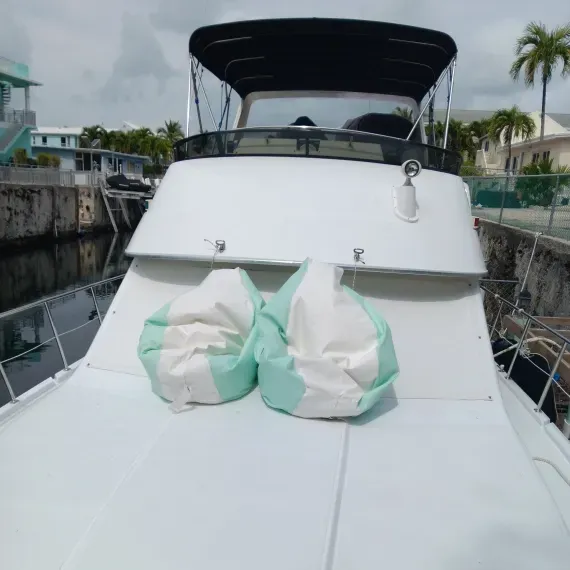 Boat deck with two green and white beanbag chairs.