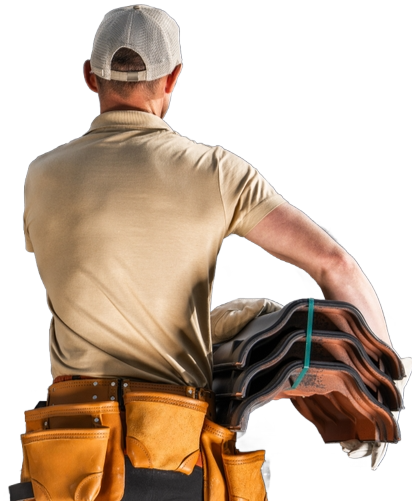 Construction worker carrying roof tiles. He wears a tool belt, tan shirt, and cap.