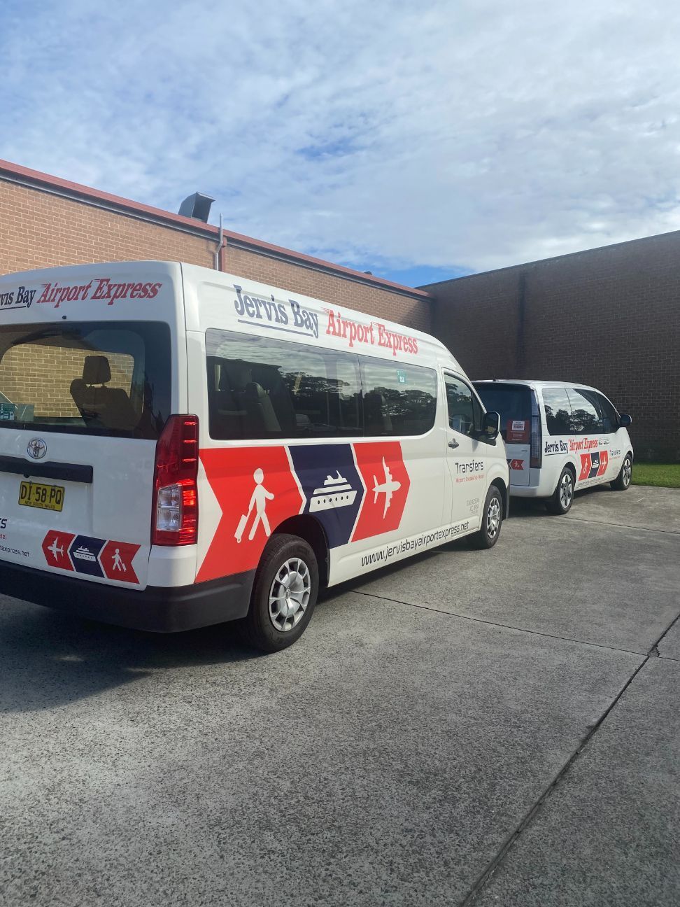 A White Van Is Parked On A Cobblestone Street At Sunrise — Jervis Bay Airport Express In Ulladulla, NSW