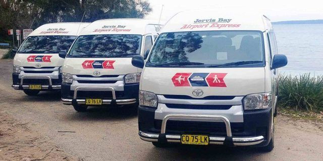 Van Transport Fleet Parked On The Road — Jervis Bay Airport Express In Ulladulla, NSW