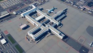 An aerial view of an airport with planes parked on the tarmac