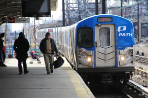 A blue and white train with the word path on the front