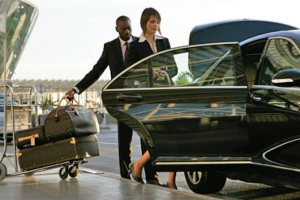 A man and a woman are getting out of a car