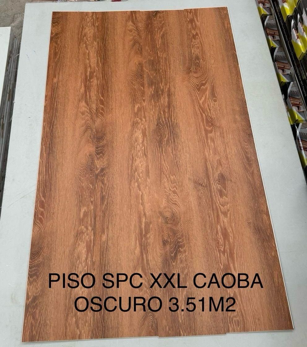 Un trozo de madera que dice piso spc xxl caoba oscuro 3.51m2
