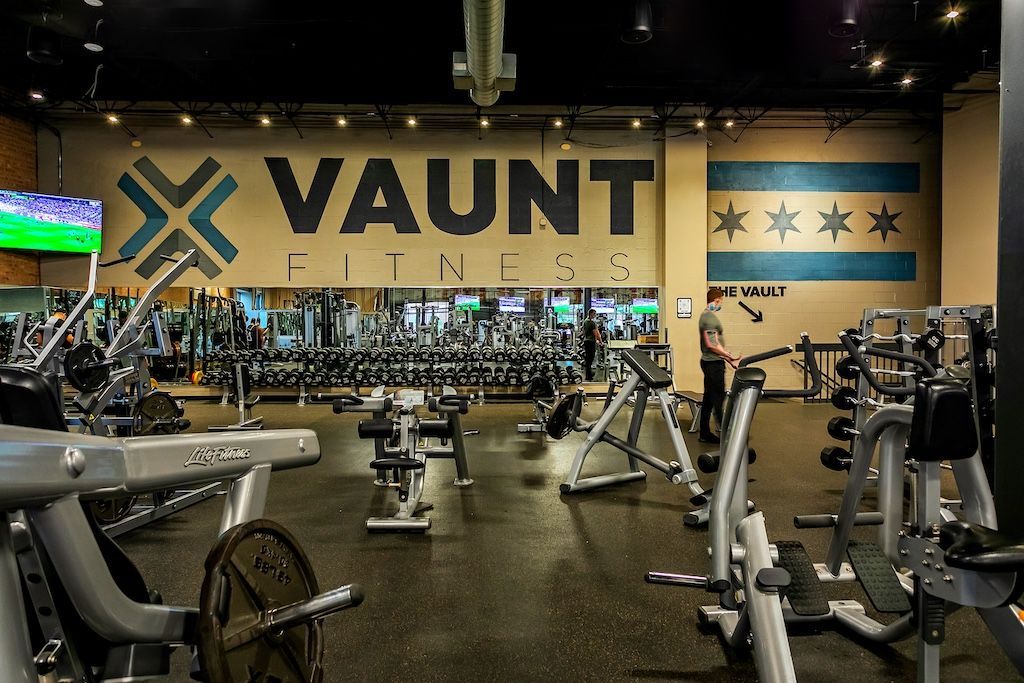 Gym interior with weights, machines, and the 
