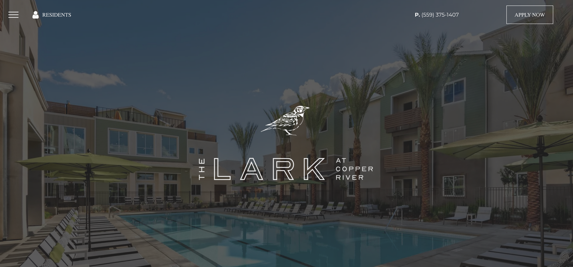 LARK logo over a pool and apartment complex. Buildings are tan and green.