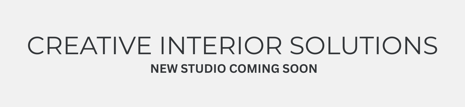 Logo for Creative Interior Solutions, featuring a head-shaped icon with a lightbulb, and text: