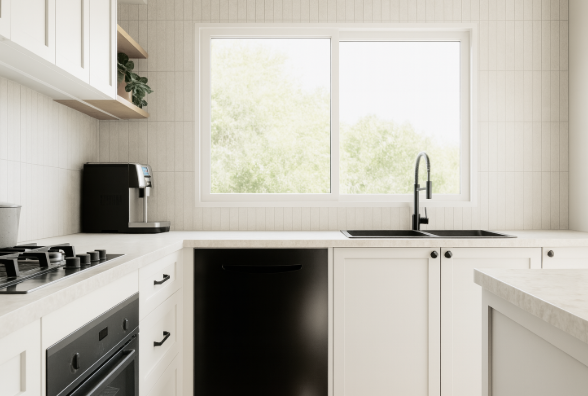 Cozy home office nook with a desk and chair, featuring a laptop and a green and patterned wallpaper.