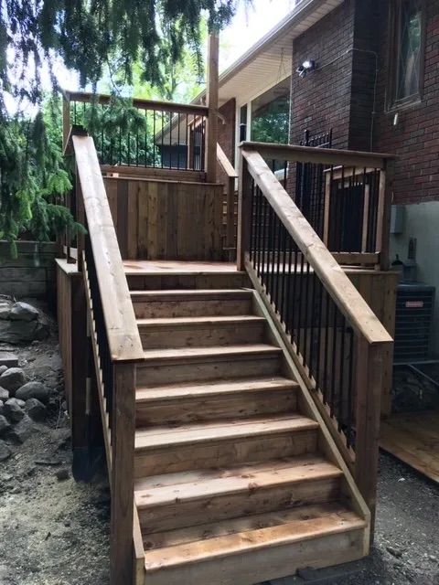 A wooden deck with stairs leading up to it