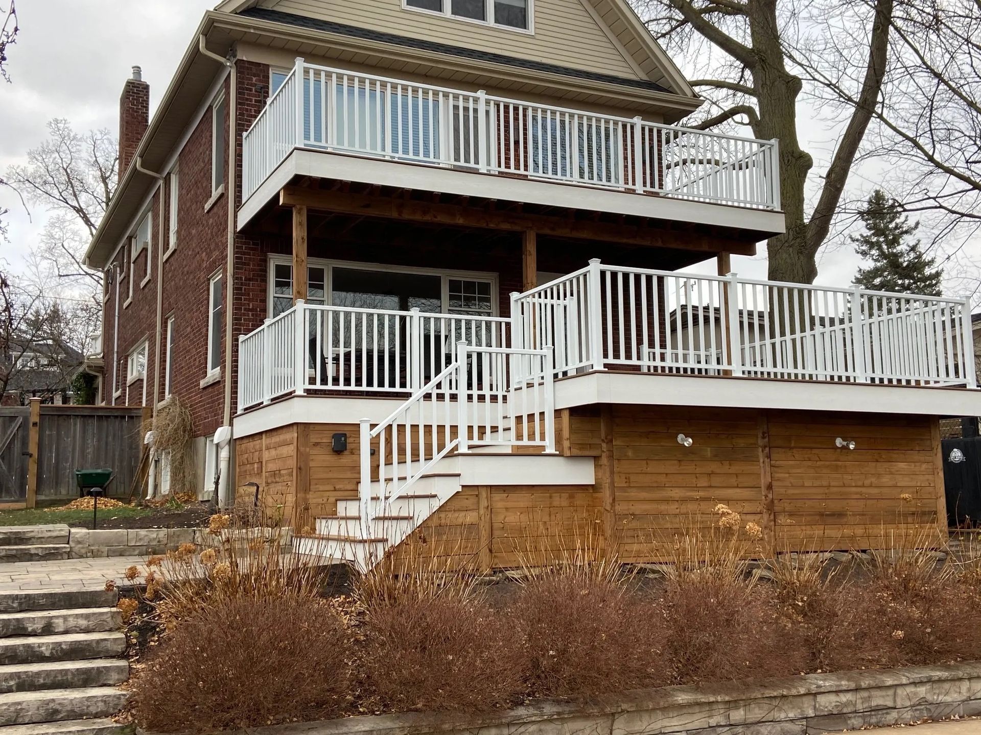 A large house with a large deck and stairs