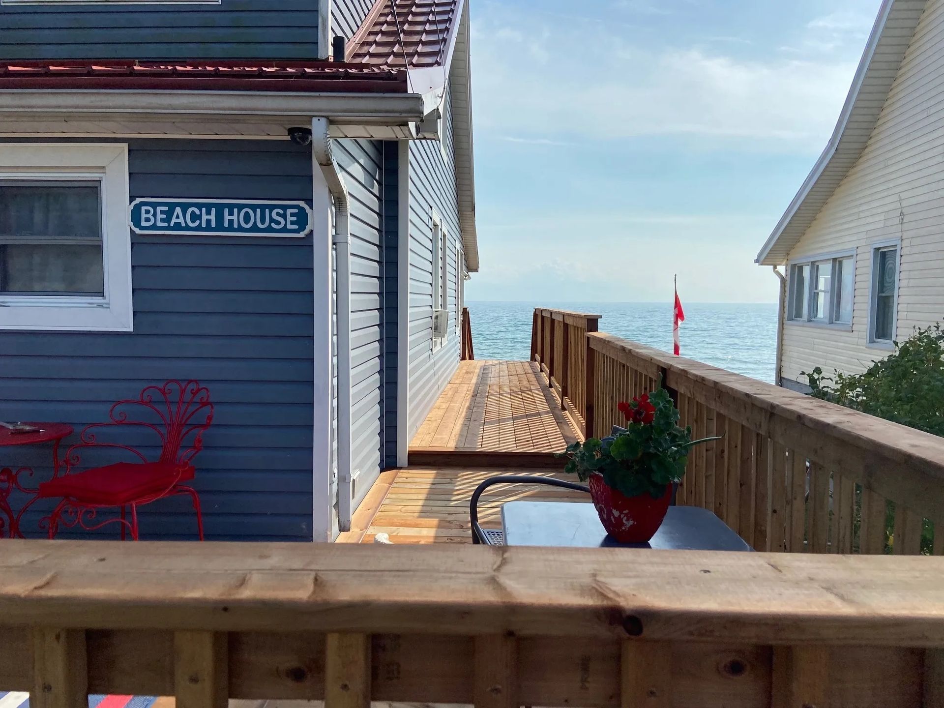 A house with a sign that says beach house on it