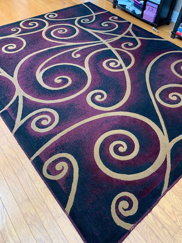 A close up of a marble floor next to a mirror.