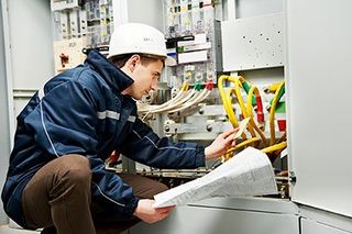 Worker checking electrical lines - Electrician in Charlottesville, VA