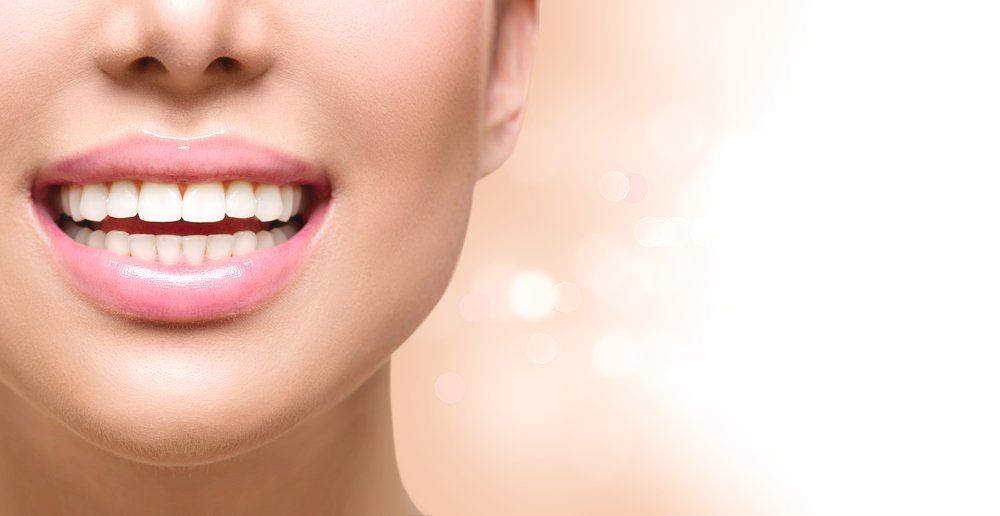 Beautiful Lips And Teeth Of A Woman — Teeth Whitening in Newcastle, NSW