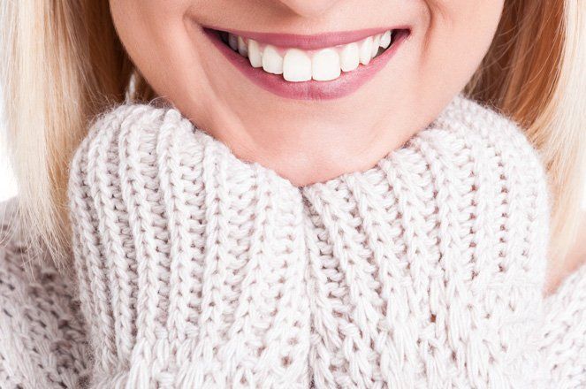 Close up of Beautiful Blonde Girl Smile Wearing Sweater — Dental Crowns in Newcastle, NSW