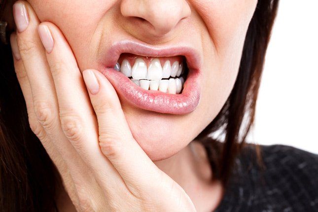 Woman with a Tooth pain — TMJ in Newcastle, NSW