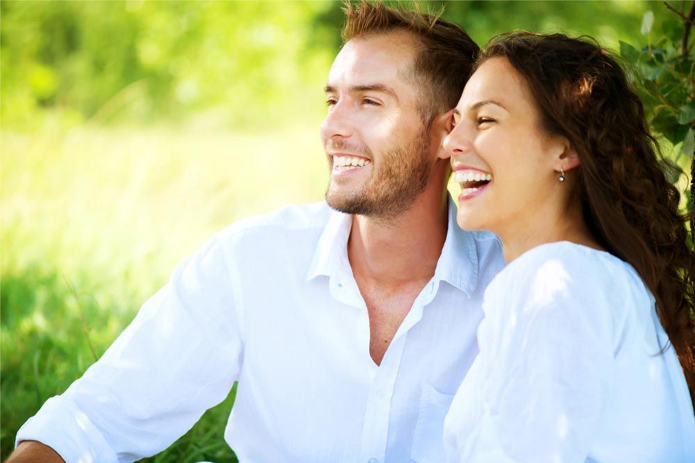 A Man And A Woman Smiling