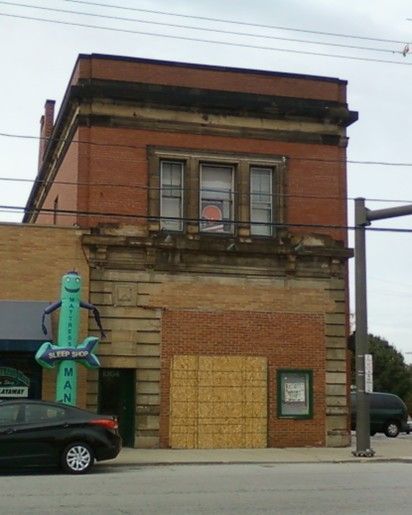 Brick building with a neon green 