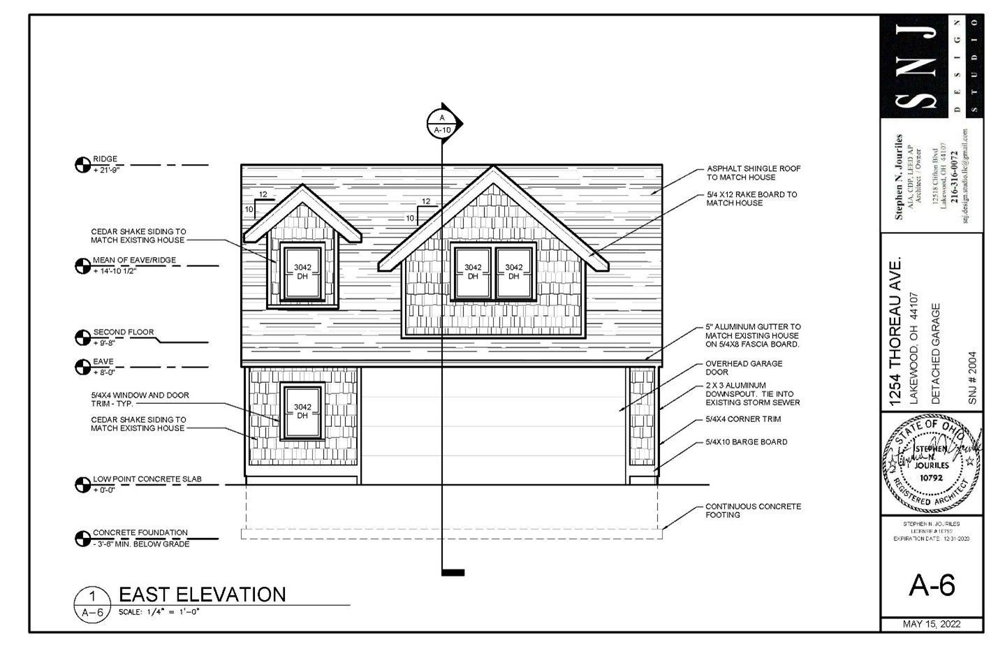 Architectural drawing of a house elevation with windows, garage door, and roof details labeled.