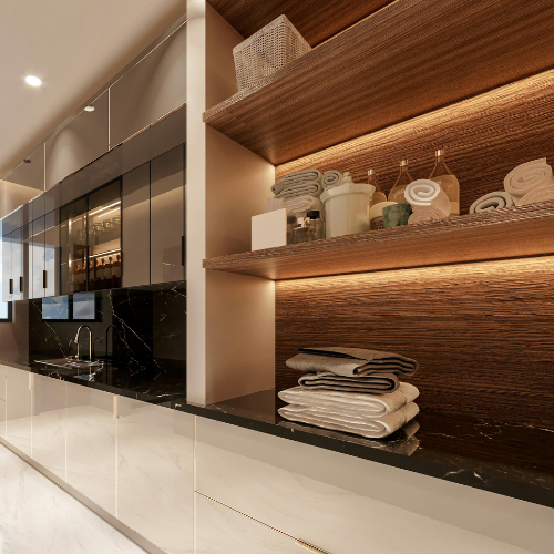 Modern laundry room with shelves, folded towels, and a dark countertop. Warm lighting highlights the wood. — Neave Electrical in Forster, NSW