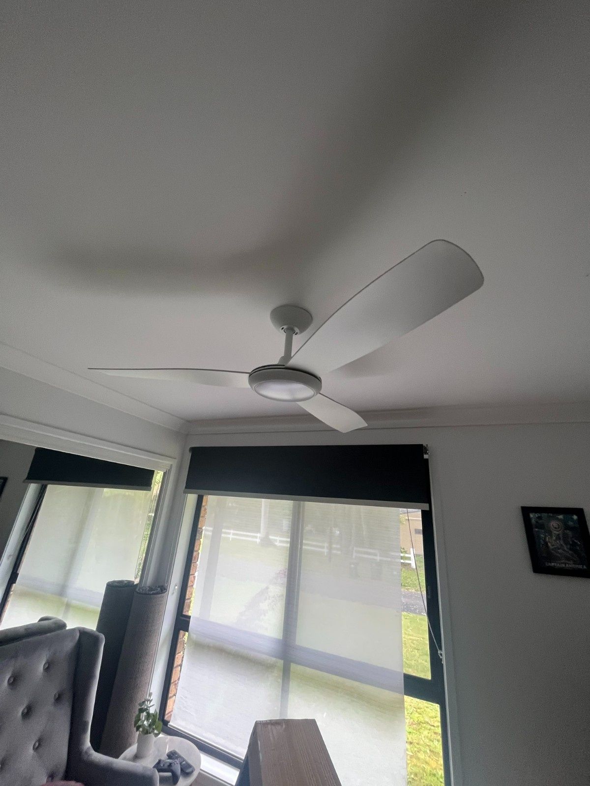 A Ceiling Fan With Light Fixture in a White Room — Neave Electrical in Forster, NSW