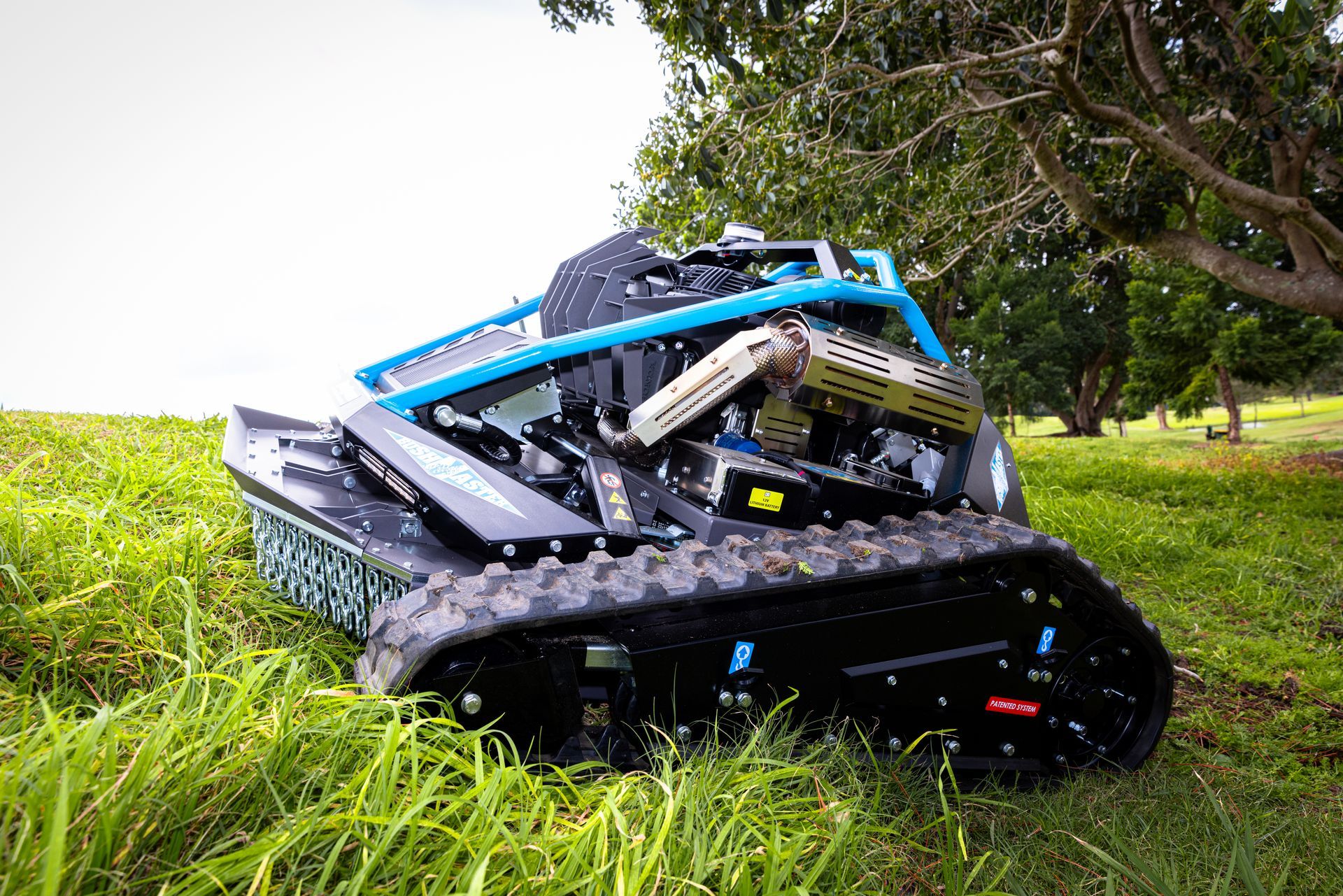 A tractor is sitting on top of a lush green field.