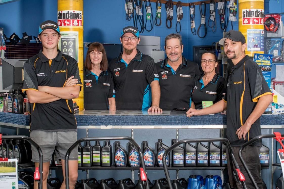 A Group Of People Standing In Front Of A Counter In A Store — Cairns Mower City In Parramatta Park, QLD