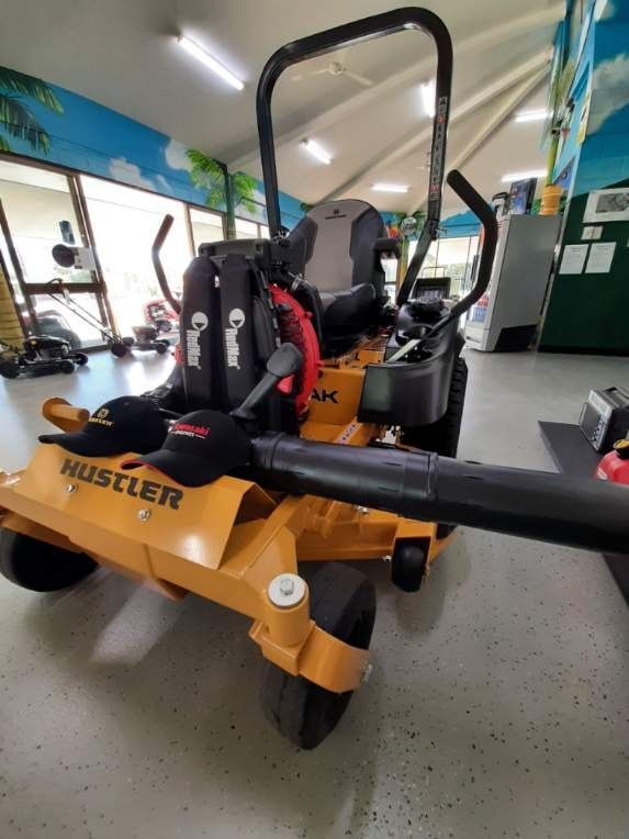 A Yellow Hustler Lawn Mower With A Blower Attached To It — Cairns Mower City In Parramatta Park, QLD