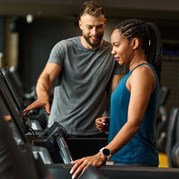Aerobics and Cardio Home Personal Trainer working with a Client on the Treadmill