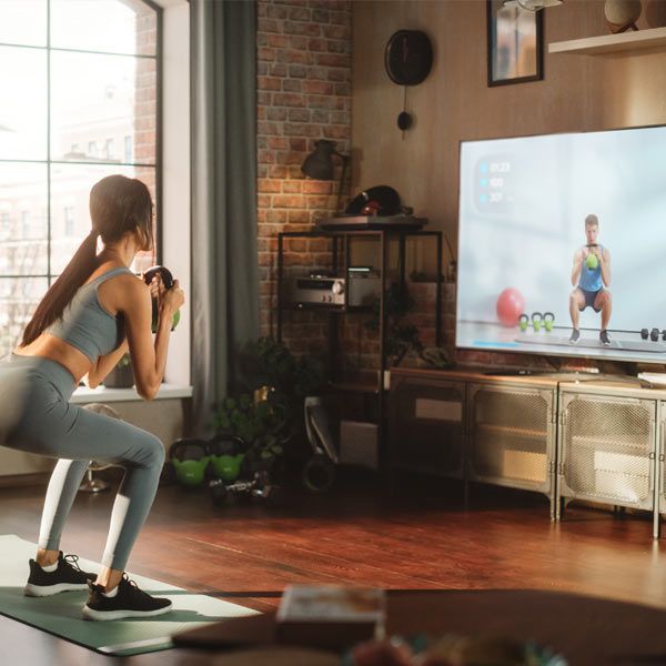 Virtual Personal Trainer Doing Kettlebell Exercises with a Client