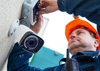 Technician Installing Video Surveillance Camera — Residential Security Systems in Fairfield, CT