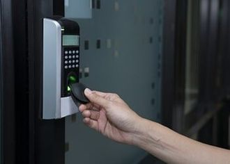Hand of a Woman Using RFID Tag Key To Open The Door—Security Systems in Fairfield, CT