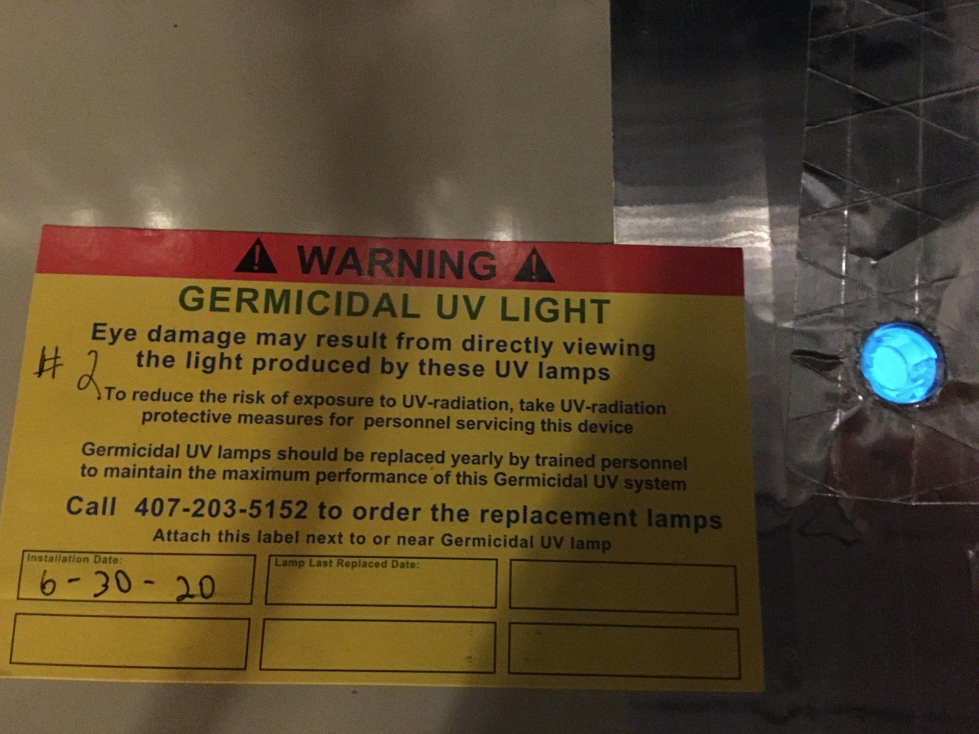 A warning sign that says ' germicidal uv light ' on it